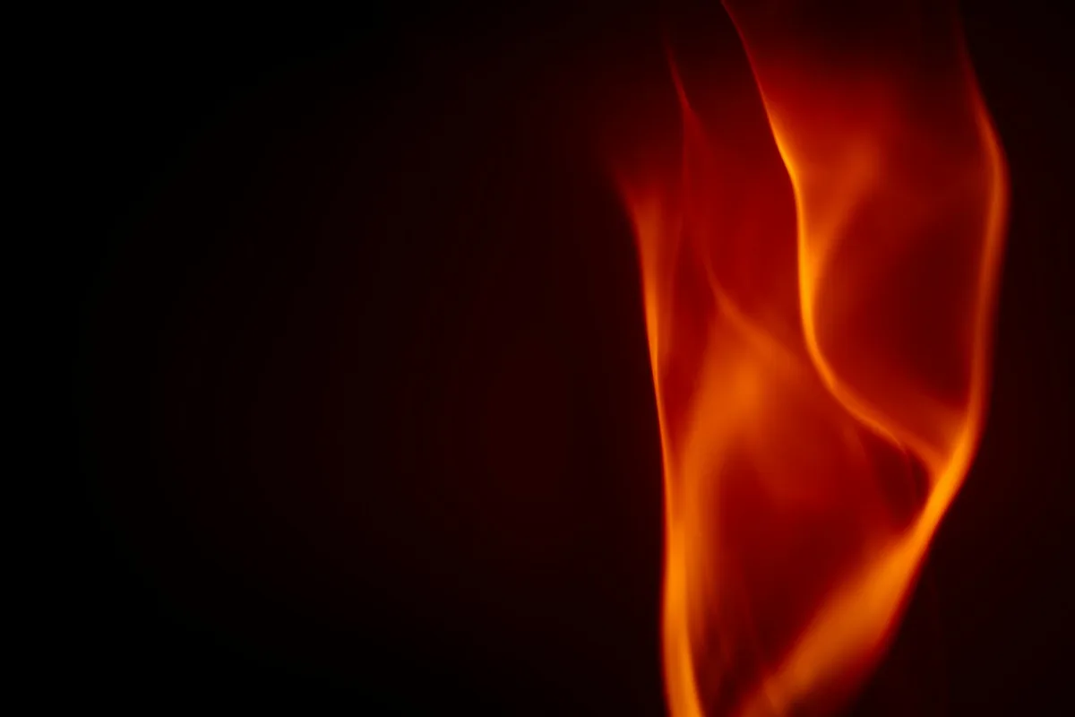 A composite image showing a gas burner, a wood stove fire, candles, and cigarette smoke.